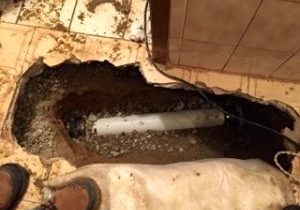 Excavated area for drain replacement.