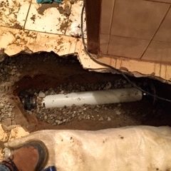 Excavated area for drain replacement.