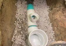 Underground backwater valve & pipe installation site