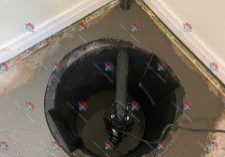 Sump pump installation in basement.