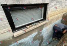 Window well installation in progress.