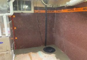 Basement with waterproofing installation visible.